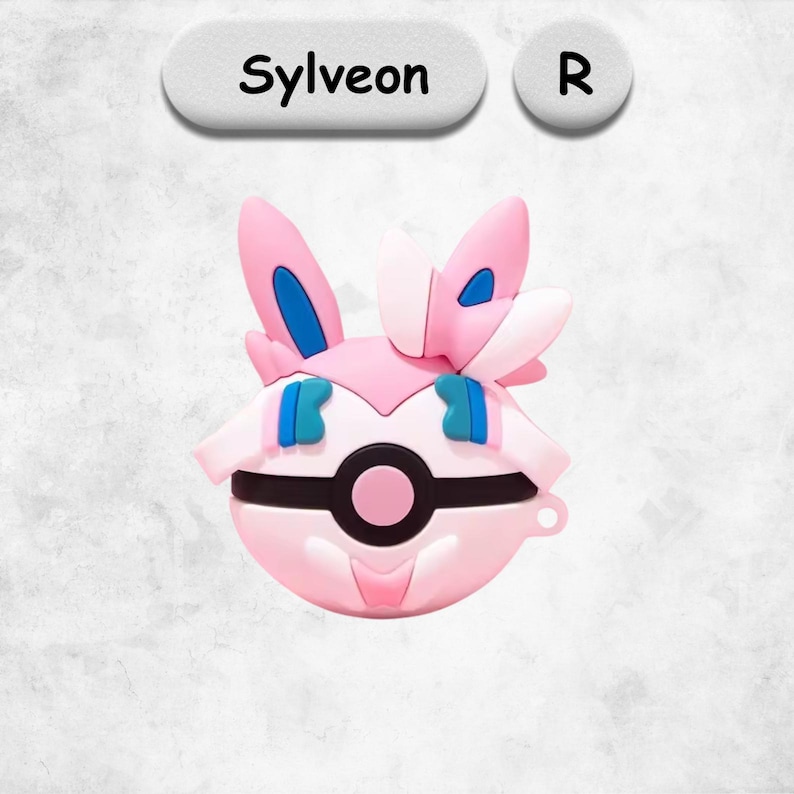 May include: A pink, spherical silicone protective case featuring the character Sylveon with long ears, blue accents, and a central black and pink circular emblem resembling a Pok&eacute; Ball. The text Sylveon and the letter R appear in white bubbles above.