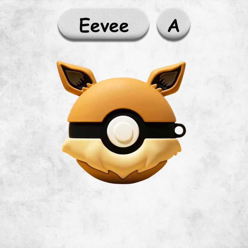 May include: A round, tan and cream-colored silicone protective case shaped like a Pokeball with Eevee-inspired ears. The case features a central white button, a black horizontal band, and the text Eevee A displayed above the object in a clear font.