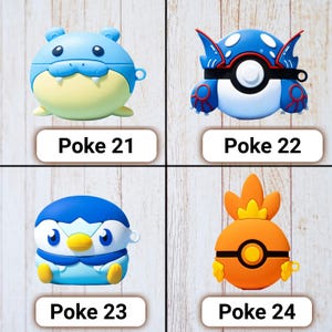 May include: Four colorful character-themed cases for electronic devices. The cases are blue, yellow, and orange, with the text "Poke 21", "Poke 22", "Poke 23", and "Poke 24" below each case. The cases are on a light wood-grain surface.