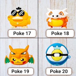 May include: Four colorful protective cases for wireless earbuds. The cases are designed to resemble cartoon characters. Each case has a different design, including a yellow duck with sunglasses, a Cubone, a Charizard, and a Poke Ball. The text "Poke" and a number are printed below each case.