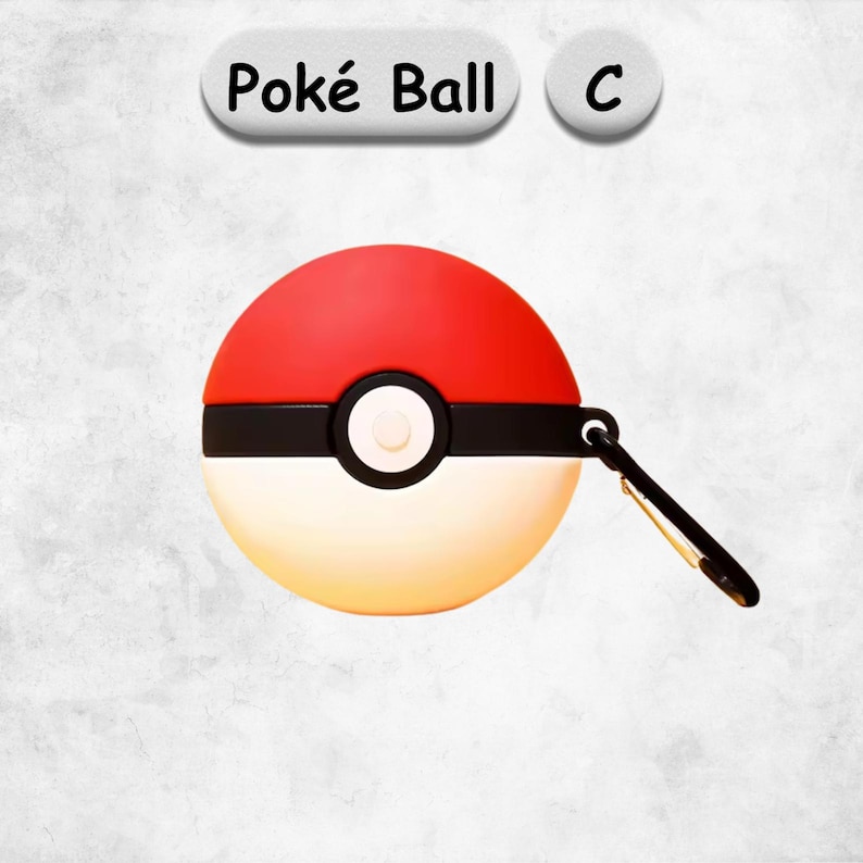 May include: A spherical protective case designed like a Pok&eacute; Ball with a red top half, a white bottom half, and a black horizontal band featuring a central white button. A black carabiner clip is attached to the side. The text Pok&eacute; Ball C is visible.