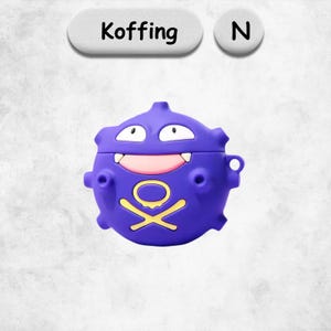 May include: A purple silicone protective case for wireless earbuds shaped like the character Koffing. The case features a wide smiling mouth with two white teeth, large white eyes, and a yellow skull and crossbones symbol on the front.