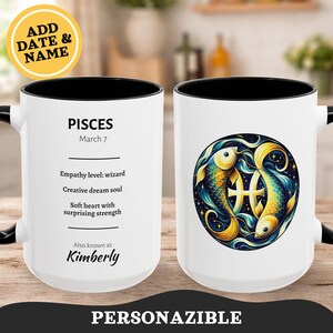 Könnte beinhalten: Weißer Keramikbecher mit schwarzem Innenraum und Griff. Der Becher zeigt das Sternzeichen Fische mit zwei Fischen in einem Kreis sowie den Text "PISCES" und "March 7". Der Becher enthält auch den Text "Empathy level: wizard", "Creative dream soul" und "Soft heart with surprising strength".