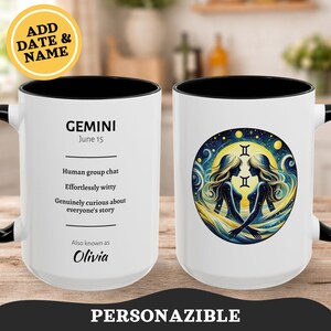 May include: White ceramic mug with a black interior and handle. The mug features a Gemini zodiac design with two figures and the text "GEMINI" and "June 15". The mug also includes the text "Human group chat", "Effortlessly witty", and "Genuinely curious about everyone's story".