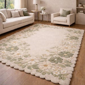 May include: Cream rectangular rug with a floral pattern. The rug has a border of green, white, and yellow flowers and leaves. It's placed on a wooden floor in a living room setting. The rug's dimensions are in centimetres.