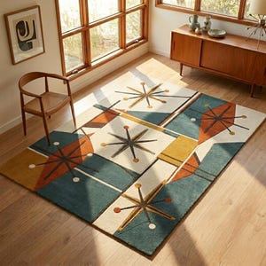 May include: A rectangular area rug featuring a geometric pattern with starburst motifs in shades of teal, burnt orange, mustard yellow, and cream. The design includes angular shapes and lines arranged in a repeating grid across the surface.