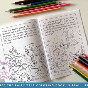 May include: Open coloring book with illustrations from "The Little Mermaid" fairy tale. The pages are open, showing line drawings of Ariel and Prince Eric. Colored pencils in various colors are scattered around the book. Text on the bottom says "SEE THE FAIRY TALE COLORING BOOK IN REAL LIFE."