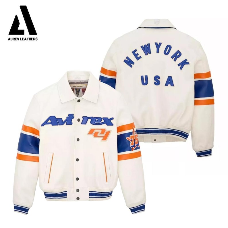 May include: White leather jacket with blue and orange accents. Features the text "Avi-rex" and "75" on the front, and "NEW YORK USA" on the back. The jacket has a button-up front, a collar, and striped cuffs and hem.