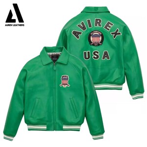 May include: A green leather jacket with the word "AVIREX" and "USA" on the back. The jacket has a front zipper, two pockets, and a white and green striped trim on the cuffs and waist. The front of the jacket has a patch with the word "AVIREX".