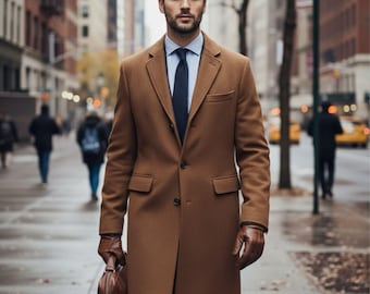 May include: A man in a brown overcoat, blue shirt, and navy tie walks down a city street. He carries a brown leather briefcase and wears brown leather gloves. The coat has a classic design with a notched lapel and two front pockets.