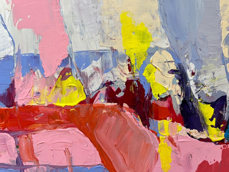 May include: Abstract artwork with bold brushstrokes in pink, yellow, red, blue, and white. The painting has a textured surface with visible paint layers, creating a dynamic and colourful composition. The style is reminiscent of expressionism.