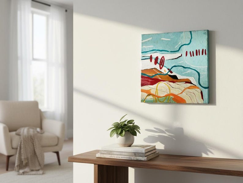 May include: Abstract landscape painting on canvas. The artwork features a light blue sky with white and teal lines, red circles and dashes. The lower portion depicts a colorful landscape with orange, red, and yellow hues.