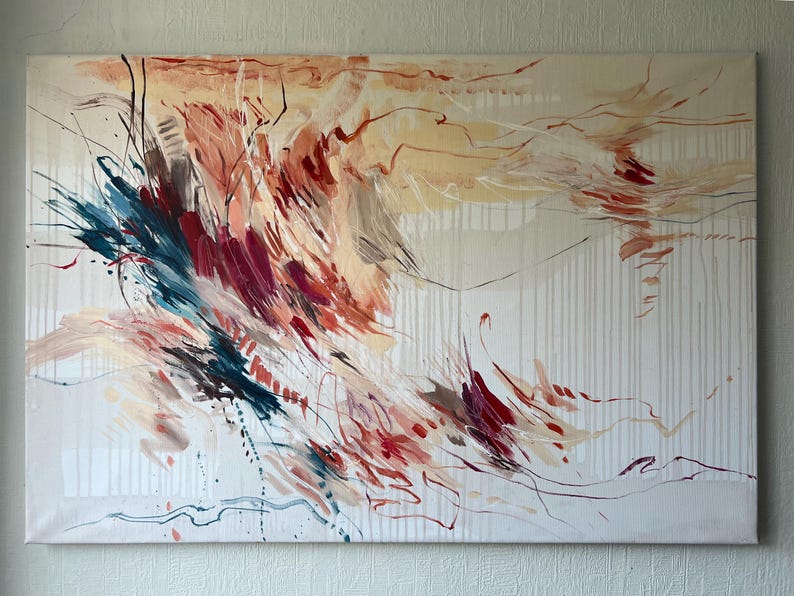 May include: Abstract canvas art featuring a dynamic composition of brushstrokes in shades of red, blue, and beige. The artwork has a textured appearance with vertical white lines and a flowing, expressive style. The painting is stretched on a rectangular frame.
