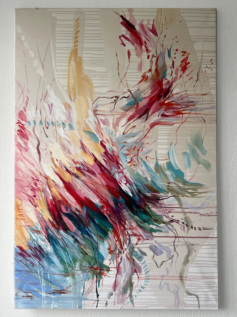 May include: Abstract painting with a beige background and colorful brushstrokes. The artwork features a dynamic composition of red, pink, blue, and yellow hues, with white and brown accents. The painting has a textured appearance and a modern aesthetic.