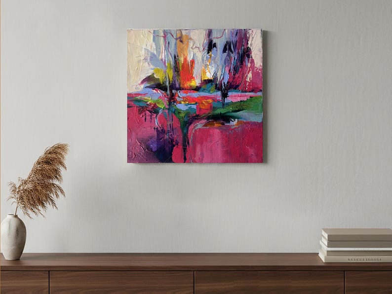 May include: Abstract oil painting on canvas. The artwork features a vibrant composition of colors, including shades of pink, green, blue, yellow, and purple. The painting has a textured appearance, with visible brushstrokes and a dynamic, expressive style.
