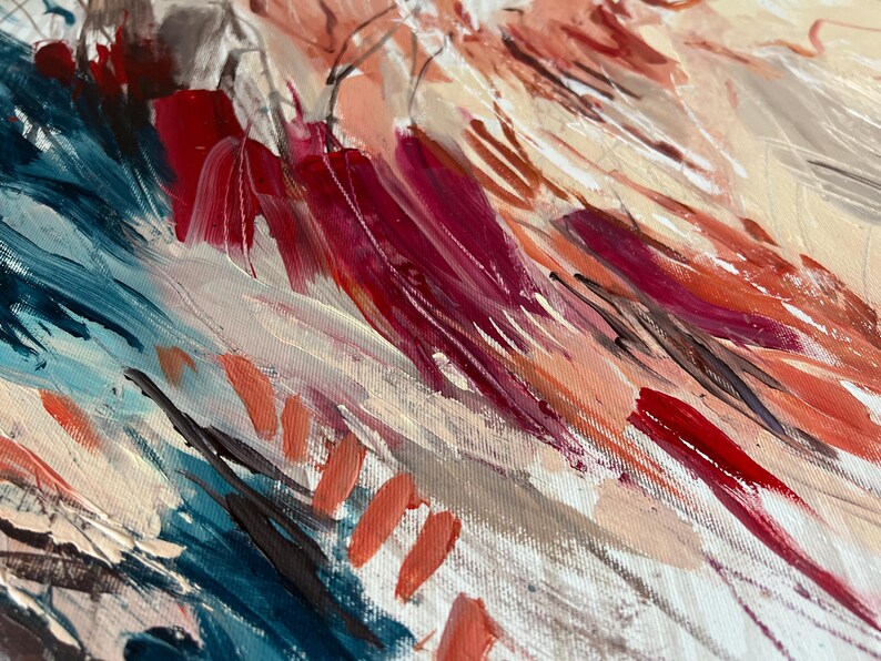 May include: Abstract painting with visible brushstrokes in shades of red, pink, blue, and beige. The artwork features a textured canvas with dynamic, expressive strokes, creating a sense of movement and depth. The color palette is warm and inviting.
