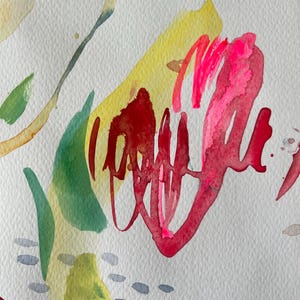 May include: An abstract watercolor painting on textured white paper featuring bold, fluid brushstrokes in vibrant shades of hot pink, deep red, and bright yellow, accented by soft green leaf-like shapes and small, scattered gray dash marks.