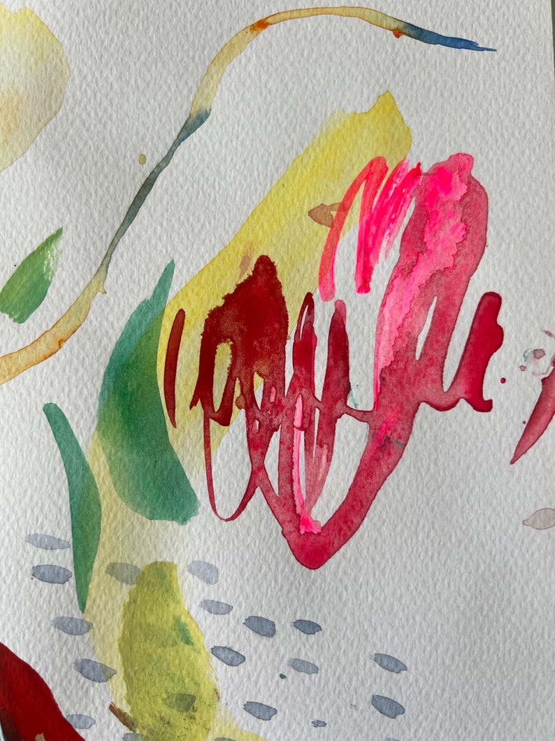 May include: An abstract watercolor painting on textured white paper featuring bold, fluid brushstrokes in vibrant shades of hot pink, deep red, and bright yellow, accented by soft green leaf-like shapes and small, scattered gray dash marks.