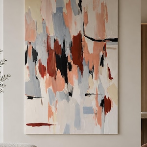 May include: A large rectangular canvas painting featuring an abstract composition of vertical brushstrokes. The colour palette consists of muted peach, soft grey, deep terracotta red, and stark black accents layered over a creamy off-white background.