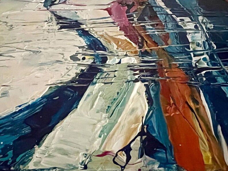 May include: Abstract painting with thick brushstrokes in shades of white, blue, orange, and pink. The textured surface creates a sense of depth and movement. The artwork appears to be an original piece, showcasing a modern art style.