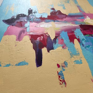 May include: Abstract painting with a palette of gold, light blue, pink, and deep red. The artwork features thick brushstrokes and textured paint, creating a dynamic and expressive composition. The painting's style is modern and bold.