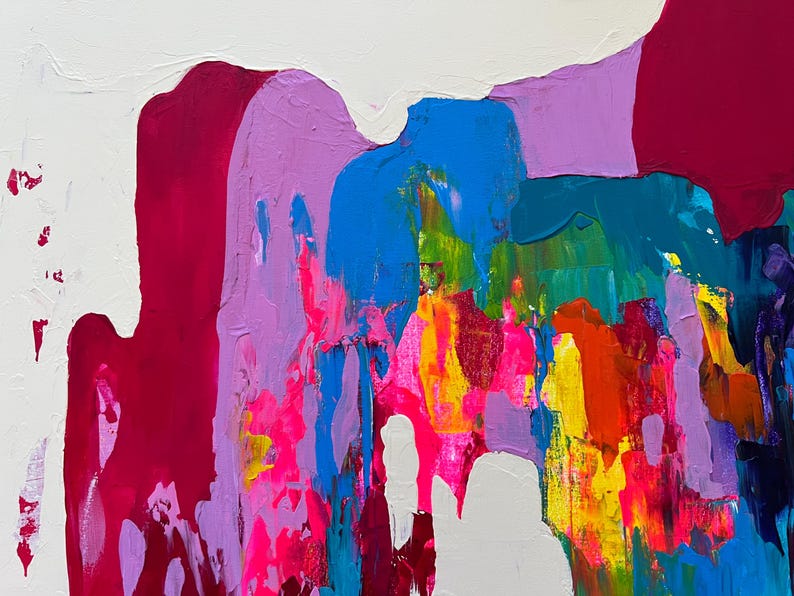 May include: Abstract artwork with thick brushstrokes in vibrant colours. The painting features a white background with bold strokes of magenta, blue, green, yellow, orange, and purple. The paint has a textured, layered appearance.