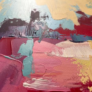 May include: Abstract painting with thick brushstrokes in shades of pink, teal, purple, and beige. The artwork features a textured surface with visible paint layers, creating a dynamic and colorful composition. The style is modern and expressive.