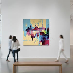 May include: An abstract painting with a light yellow background, featuring bold strokes of blue, red, and pink. The artwork is displayed in a modern art gallery setting, with blurred figures of people walking by.