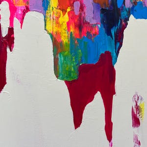 May include: Abstract artwork with a textured surface. The painting showcases a vibrant mix of colours, including white, red, blue, yellow, pink, and purple. The composition includes large white shapes against a backdrop of colourful brushstrokes.