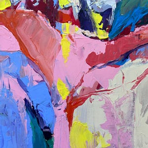 May include: Abstract artwork with bold brushstrokes in pink, blue, red, yellow, and white. The painting has a textured surface with visible layers of paint, creating a dynamic and expressive composition. The colours blend and contrast, forming an energetic visual experience.