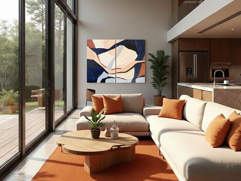 May include: A modern living room with large windows and an open floor plan. The room features a beige sectional sofa with orange throw pillows, a wooden coffee table, and an orange rug. Artwork with blue, beige, and orange tones hangs on the wall.