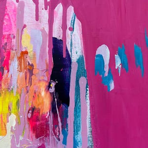 May include: Abstract painting with a vibrant mix of colors. The artwork features a blend of pink, magenta, yellow, orange, and blue hues. Vertical drips and brushstrokes create a dynamic and textured composition.