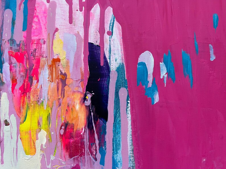 May include: Abstract painting with a vibrant mix of colors. The artwork features a blend of pink, magenta, yellow, orange, and blue hues. Vertical drips and brushstrokes create a dynamic and textured composition.