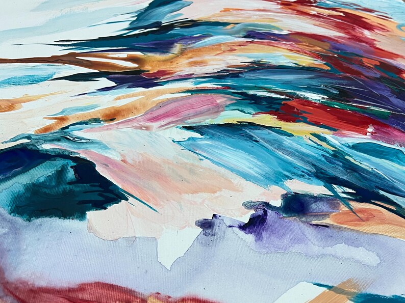 May include: Abstract painting with a dynamic composition of brushstrokes in various colors. The artwork features a blend of blues, reds, pinks, and oranges, creating a sense of movement and depth. The painting is on a white canvas.