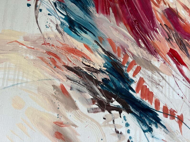 May include: Abstract painting with bold brushstrokes in shades of red, blue, and peach on a white canvas. The artwork features a dynamic composition with visible texture and a variety of colors, creating a sense of movement and depth.