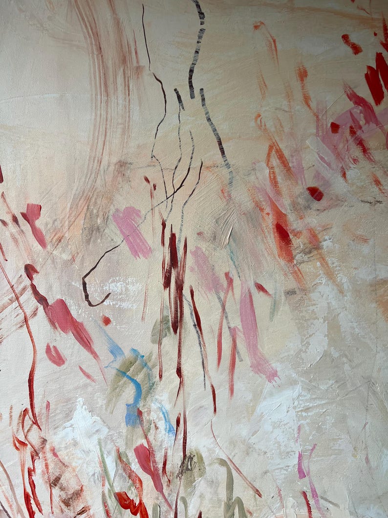 May include: An abstract painting on canvas featuring a light beige background with layered brushstrokes in shades of red, pink, and white. Thin, dark, vertical lines are drawn across the surface, intersecting with scattered paint marks.