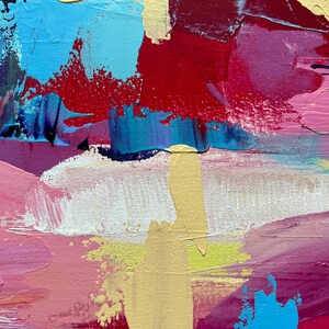 May include: Abstract painting with thick brushstrokes in shades of blue, red, pink, and yellow. The artwork features a textured surface with visible paint layers, creating a dynamic and colorful composition. The style is reminiscent of expressionism.