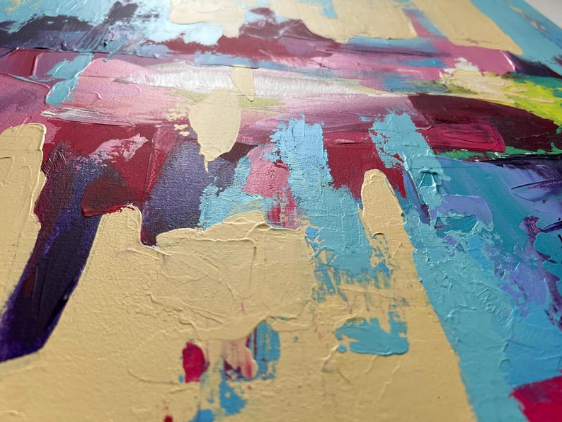 May include: Close-up of an abstract painting with thick brushstrokes. The artwork features a palette of colors including light blue, pink, purple, yellow, and red. The texture of the paint is visible, creating a dynamic and textured surface.