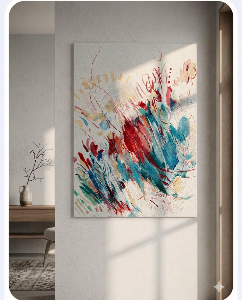 May include: A rectangular canvas painting featuring abstract brushstrokes in vibrant shades of red, teal, and yellow against a neutral off-white background. The composition includes dynamic lines, layered paint textures, and scattered marks.