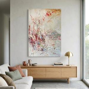 May include: A large vertical rectangular canvas painting featuring abstract brushstrokes in shades of crimson, deep red, soft beige, and muted green. The composition displays dynamic, flowing lines and scattered paint splatters across a light background.