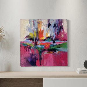 May include: Abstract painting with a vibrant color palette. The artwork features bold brushstrokes in shades of pink, red, blue, green, and yellow. The composition is a landscape-inspired design, with a textured surface.