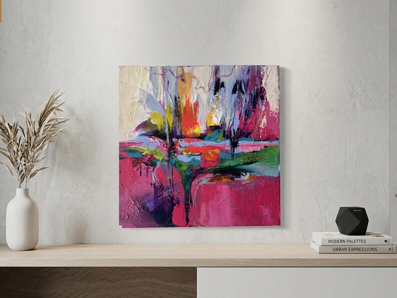 May include: Abstract painting with a vibrant color palette. The artwork features bold brushstrokes in shades of pink, red, blue, green, and yellow. The composition is a landscape-inspired design, with a textured surface.