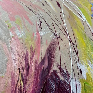 May include: Abstract painting with a textured canvas. The artwork features a blend of colors, including pink, yellow, purple, and blue, with white and dark brown accents. The brushstrokes are visible, creating a dynamic and expressive composition.
