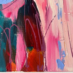 May include: Abstract painting with a palette of pink, teal, red, and purple. The artwork features brushstrokes and drips, creating a textured surface. The composition includes areas of dark and light tones, with a focus on color and form.