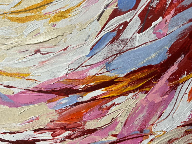 May include: Abstract painting with thick brushstrokes in shades of red, white, pink, blue, orange, and gold. The textured surface creates a dynamic and expressive artwork, evoking a sense of movement and depth. The artwork is a close-up of the painting.