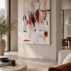 May include: A large rectangular canvas painting featuring an abstract composition of vertical brushstrokes in shades of terracotta, soft peach, light grey, cream, and bold black accents, displayed on a neutral wall in a bright living space.