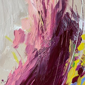 May include: Abstract painting with textured brushstrokes in shades of pink, magenta, and yellow. The artwork features a beige background with white and yellow accents. The painting has a modern, expressive style.
