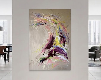 May include: Abstract painting with a beige background and a dynamic composition of colorful brushstrokes. The artwork features vibrant hues of purple, yellow, pink, and green, creating a sense of movement and energy. The painting is displayed in a modern living space.