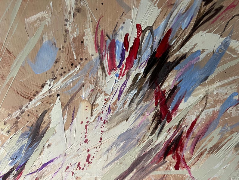 May include: Abstract painting with a beige background and dynamic brushstrokes in white, red, blue, and black. The artwork features a textured surface with splatters and streaks, creating a sense of movement and depth. The style is expressive and modern.