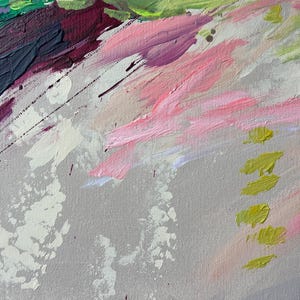 May include: Abstract painting with a textured canvas. The artwork features diagonal brushstrokes in shades of pink, green, purple, and white against a gray background. Splatters of white and yellow add visual interest to the piece.